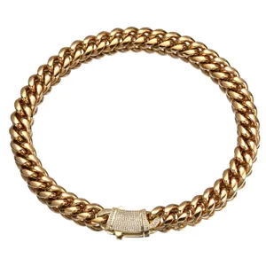 Gold stainless steel Cuban link chain necklace detail, micro-paved diamond box clasp design.