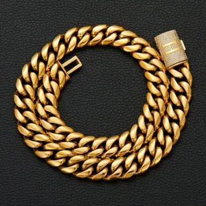 Detailed shot of gold-plated Cuban link chain necklace with iced-out letter H box clasp.