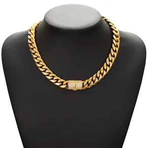 Men hip hop gold cuban link necklace with letter J rhinestone paved clasp detail shot.