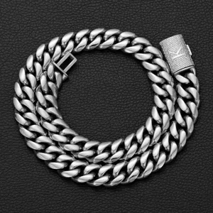 Men hip hop steel color Cuban link chain necklace with iced out flip clasp and letter K detail.