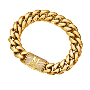 Gold Cuban link chain detail showing iced out clasp with custom letter M pendant design.