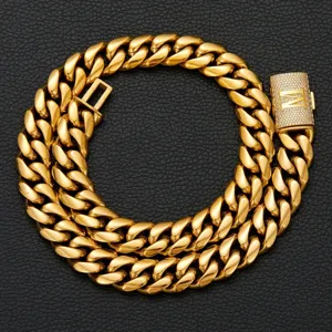Detailed close-up of a gold-colored men hip-hop Cuban link chain necklace with iced-out letter clasp.