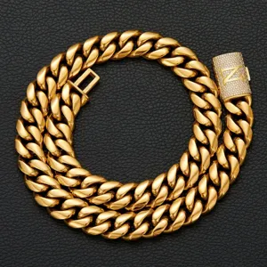 Close-up detail of luxury gold Cuban chain necklace featuring a paved diamond initial N clasp.
