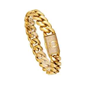 Close-up detail of the gold cuban link chain featuring a pave crystal letter clasp.