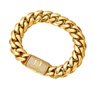 Gold chunky cuban link chain necklace featuring a paved rhinestone letter clasp detail.