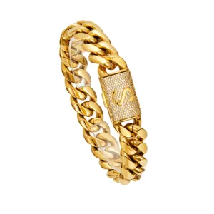 Detailed view of men's hip hop gold Cuban link chain necklace with letter S diamond clasp.