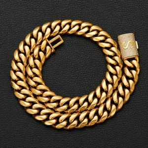 Detailed close-up of a men gold cuban link chain necklace featuring a rhinestone letter clasp.