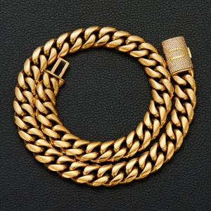 Gold tone hip hop Cuban link necklace featuring paved letter clasp, detailed close-up view.