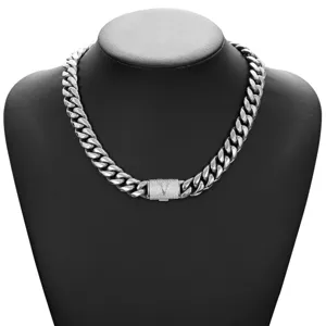 Detailed view of men chunky cuban link chain necklace with letter V paved clasp in silver.