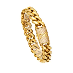 Close-up of the gold hip hop Cuban link chain with a paved letter X clasp detail.