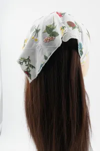 Floral embroidered cotton grid triangular headscarf detail view, stylish hair accessory.