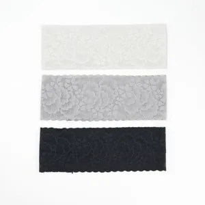 Detailed view of the elastic lace headbands featuring delicate floral patterns and wavy edges.