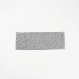 Grey lace hair band detail, showing the delicate floral pattern and stretchy wavy edge design.