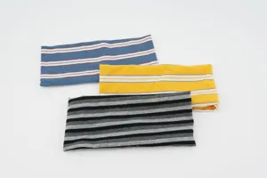 Detail view of striped elastic knit headband, ideal for sports, yoga, and daily wear.