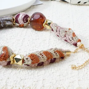 Bohemian fabric beaded necklace detail view, Maillard style colorful choker accessory.