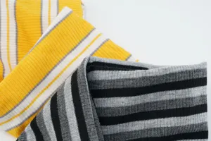 Close-up detail of striped ribbed knit headband showing the elastic fabric texture and clear pattern.