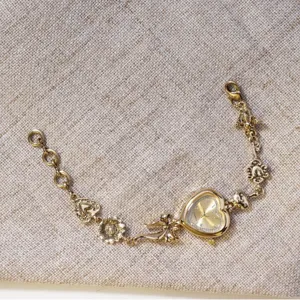 Vintage gold heart bracelet watch with bowknot and floral charms for women fashion style