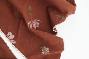 Caramel retro embroidered triangle headscarf with delicate cross stitch flowers and lace trim.