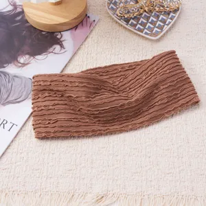 Brown knitted elastic headband hair accessory detail shot, cozy texture and daily stylish wear.