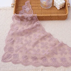 Elegant pink lace triangular scarf with delicate floral embroidery and charming scalloped edges.