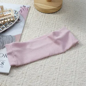 Pink ribbed headband for women, soft elastic hair band for sports, yoga and daily wear.
