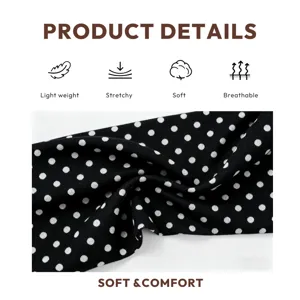 Black and white polka dot knit wide headband, stretchy soft breathable hair accessory detail.