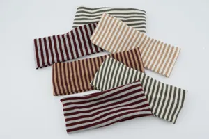 Close-up of women's vintage striped knit sports headband, showing various elastic color options.