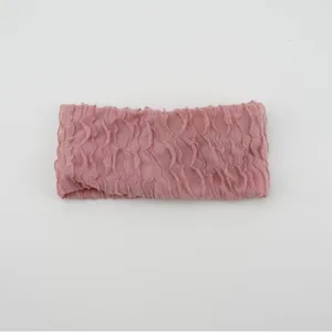 Pink ruffled knitted headband for women, elastic stretch hair band for yoga and daily wear.