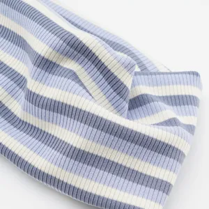 Blue striped knit headband, elastic athletic hair band, stylish fashion hair accessory detail.