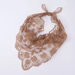 Lace floral embroidery detail on the brown triangle headscarf, showing delicate hollow design.