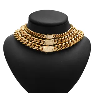 Detailed view of men gold titanium steel cuban link chain necklace with luxury diamond clasps.