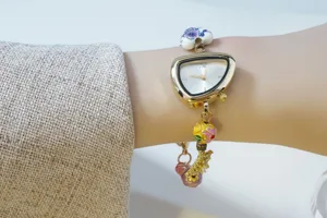 Gold irregular dial women watch with ceramic and enamel beads handmade chain bracelet.