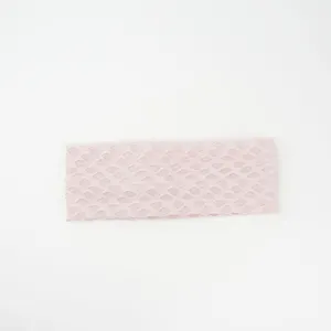 Pink mesh knit headband detail, stretchy textured hair accessory, wide casual hairband.