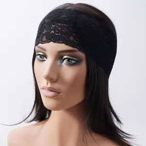 Detailed view of the black lace headband, showcasing the delicate hollow-out floral texture.