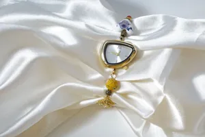 Elegant irregular gold women's watch with ceramic and enamel beaded handmade chain.