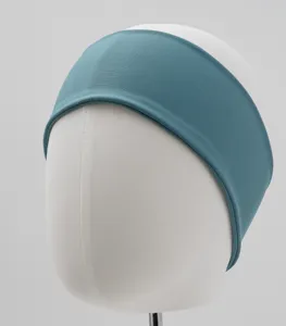 Detailed close-up of a wide elastic teal fabric headband for women, soft stretch hair accessory.