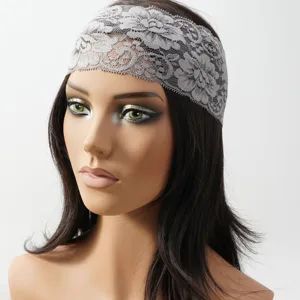 Close up detail view of the elegant grey wide lace hairband, showing delicate hollow pattern.