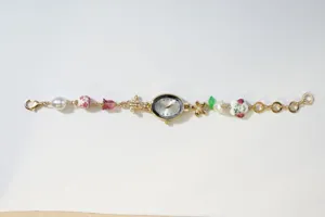 Vintage oval quartz watch with pearl and floral beaded bracelet for women, elegant jewelry.