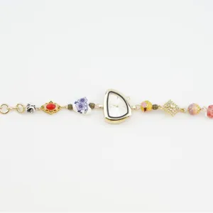 Elegant gold irregular dial women watch with handmade beaded ceramic and crystal bracelet.