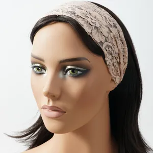 Close-up detail of the elegant wide lace headband showcasing delicate hollow floral patterns.