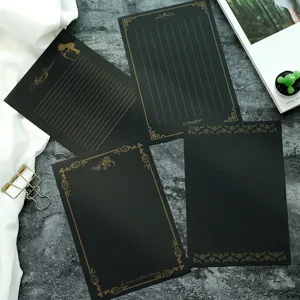 Set de papel de carta negro vintage con elegante borde de lámina dorada para escribir