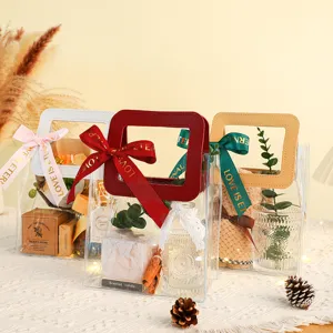 Bolsas de regalo transparentes de PVC con asas y cintas, ideales para envolver flores y dulces.