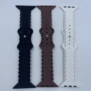 Close-up detail of silicone leopard print watch bands in black, brown, and white colors.