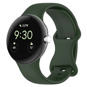 Green silicone replacement watch strap detail, smooth texture, comfortable fit, secure buckle.
