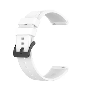 Silicone watch strap replacement band detail view, flexible white rubber strap with black buckle.