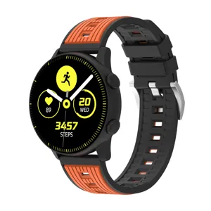 Closeup detail of the black and orange silicone smartwatch strap with vertical stripes.