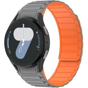 Close-up detail of magnetic silicone watch strap in grey and orange, flexible and durable.