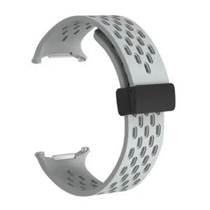 Grey silicone magnetic watch strap detail, breathable perforated sports band replacement.
