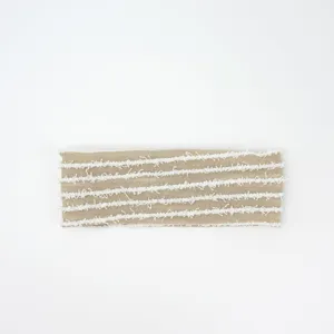 Retro wide knit headband with white frayed striped design, soft elastic hair accessory.