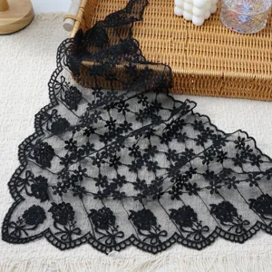 Black lace embroidered triangular scarf with floral scalloped edges for elegant styling.